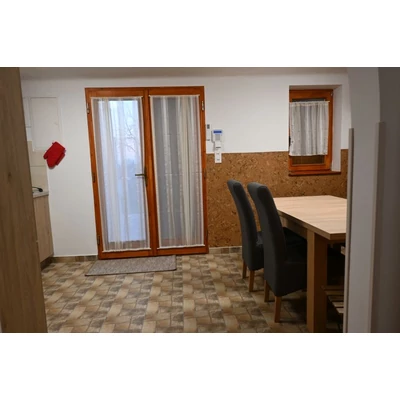 Strázsahegyi Napocska Guesthouse, living room, kitchen and table